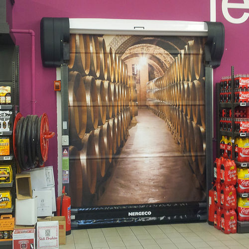 Складное промышленные ворота - SUPERSTORES - NERGECO - из металла / автоматическое / для ангара