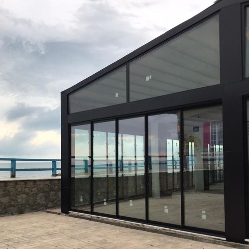Раздвижное и и складываемое панорамное окно - WITH THRESHOLD - BKS balcony glazing systems - из алюминия / 3 створки / 2 створки