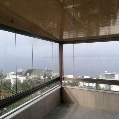 Складное панорамное окно - FRAMELESS SYSTEM WITHOUT GUIDE - BKS balcony glazing systems - из алюминия / 3 створки / 2 створки