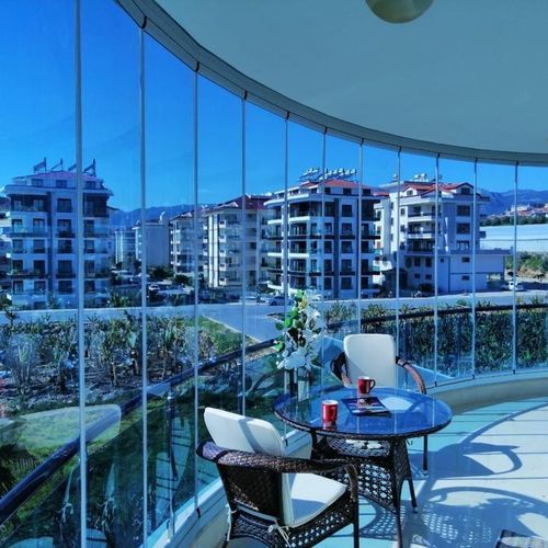 Окно с балконом из стекла - BKS balcony glazing systems - из алюминия / раздвижное и и складываемое / акустическое