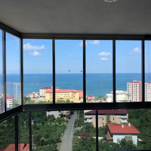 Раздвижное панорамное окно - ICS - BKS balcony glazing systems - складное / из алюминия / с двойным остеклением