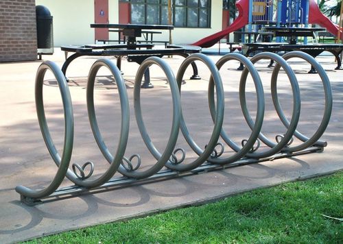 Напольная парковка для велосипедов - SPIRAL - CANTERBURY DESIGNS - для общественных мест / из нержавеющей стали / из алюминия