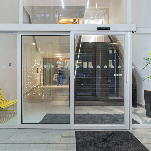 Система скольжения из алюминия - SL521 Telescopic - ASSA ABLOY Entrance Systems - для стеклянной двери / скрытые бегунки / для профессионального использования