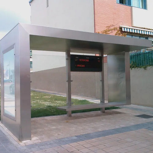 Крытая автобусная остановка из гальванизированной стали - ESTEVA BARCELONA - из стекла / со скамейкой / с доступом для лиц с ограниченными возможностями