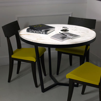 Современный обеденный стол - ALEXIS - Atelier-alain-ellouz - из алебастра / с основанием из металла / круглый