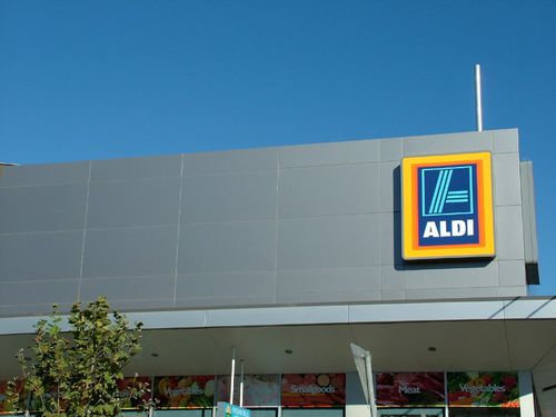 Панельная облицовка фасада - ALDI STORES - VITRAPANEL - Vitragroup - из волокнистого цемента / глянцевая