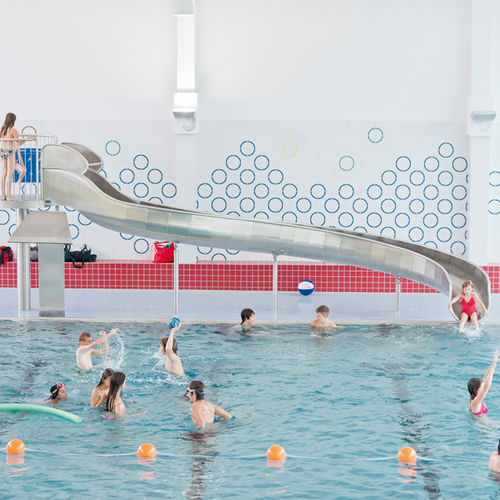 Поворотная горка - INDOOR EGGENSTEIN-LEOPOLDSHAFEN - atlantics GmbH - для общественного бассейна / из нержавеющей стали