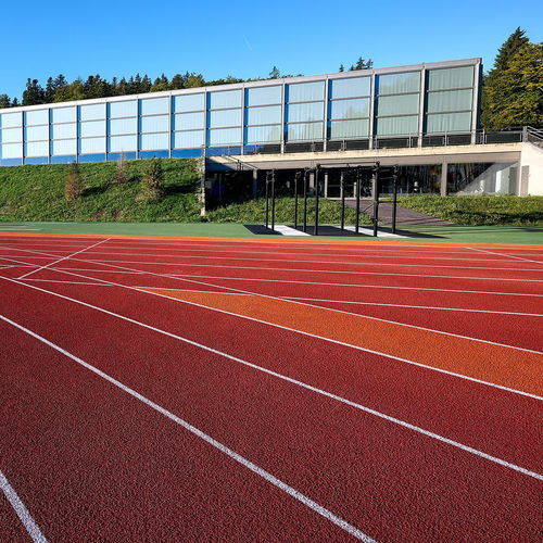 Спортивное покрытие для наружного применения - RE-TOPPING SYSTEMS - Polytan GmbH - из эластомера / из каучука / для школ